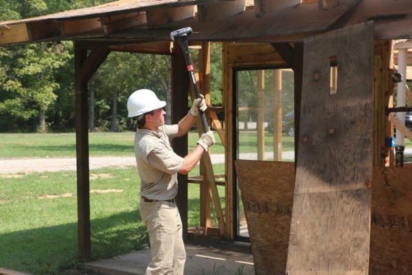 JC hammering something